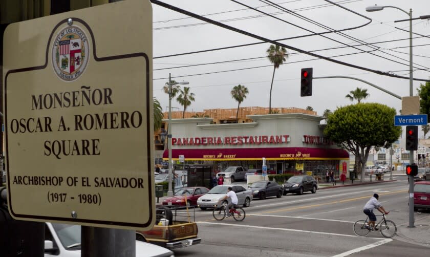 A commemorative plaque for Catholic archbishop Oscar Romero is displayed at the center of Los Angeles' Salvadoran community, where immigrants are pushing for a corridor designation like the Koreatown, Chinatown, and Little Tokyo neighborhoods, in Los Angeles on Monday, April 23, 2012. A bustling Salvadoran population lives south of downtown near the intersection of Pico Blvd. and Vermont Ave., where the square was dedicated Saturday April 21,2012 to Archbishop Romero killed in 1980 during El Salvador's civil war. (AP Photo/Damian Dovarganes)