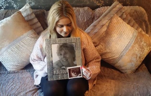 Mom-to-be Emily Beckett holding photos of her grandmother and her ultrasound. (Photo: Emily Beckett)