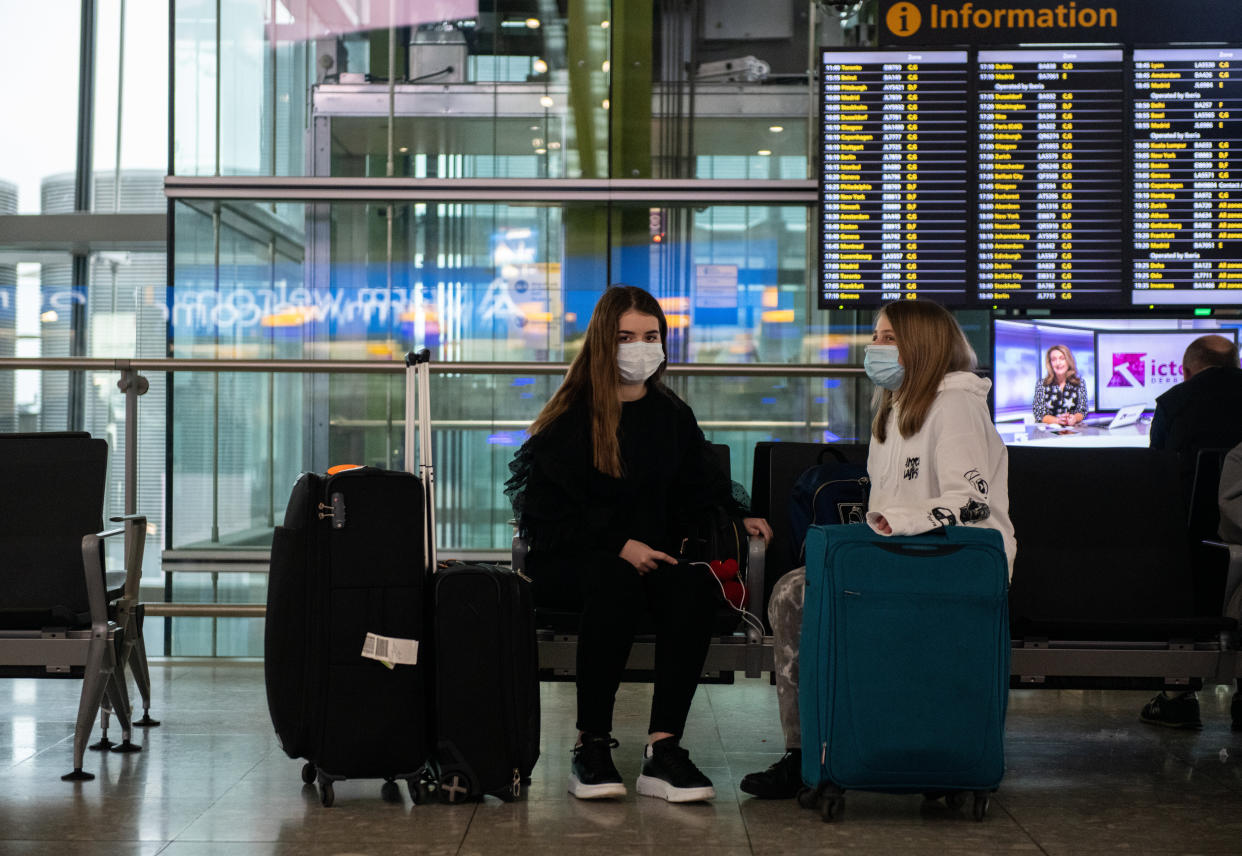 Face masks will likely be a common sight at airports and other high-traffic places.  (Photo: Chris J Ratcliffe via Getty Images)