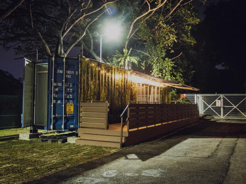 The Shipping Container Hotel at night.