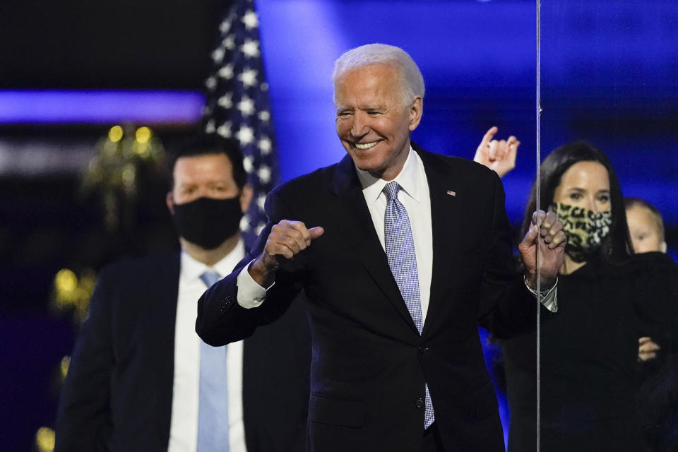 President-elect Joe Biden reacts as he stands on stage after speaking Saturday, Nov. 7, 2020, in Wilmington, Del. (AP Photo/Andrew Harnik)