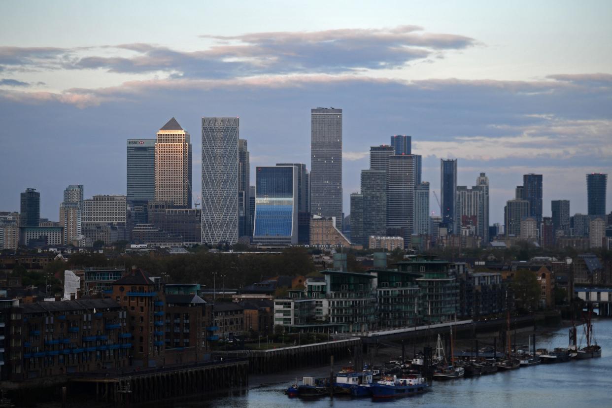 The secondary central business district of Canary Wharf is pictured as the sun sets in London