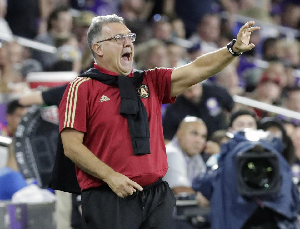 FILE - In this Aug. 24, 2018, file photo, Atlanta United MLS soccer team head coach Gerado ""Tata" Martino directs his players during the second half of a match against Orlando City, in Orlando, Fla. Coach Tata Martino is leaving Atlanta United at the end of the MLS season. United made the announcement Tuesday, Oct. 23, 2018, saying Martino turned down an offer to extend his two-year contract beyond 2018. (AP Photo/John Raoux, File)