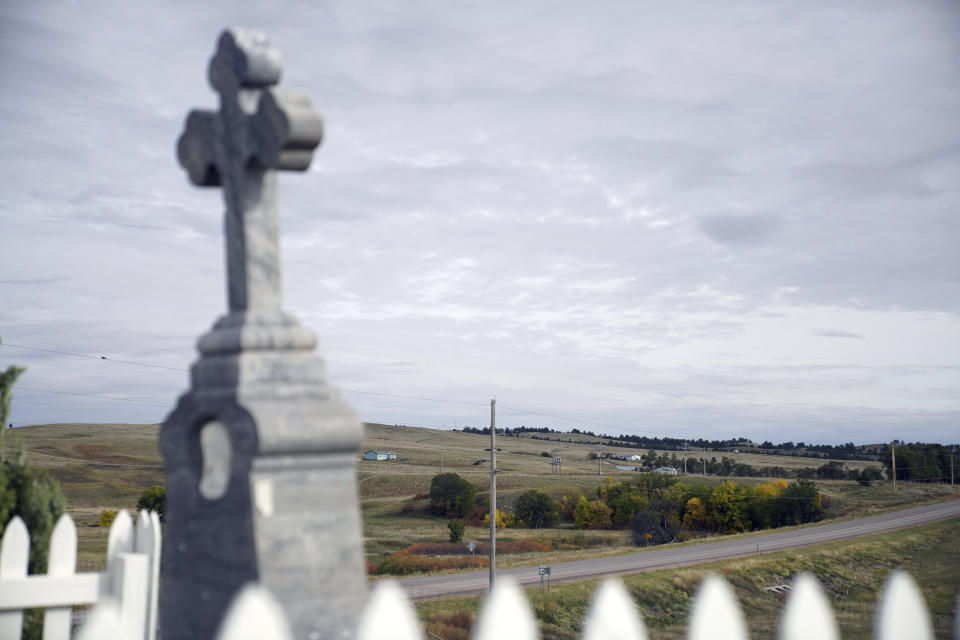 Pine Ridge Indian Reservation is seen from the burial place of Chief Red Cloud, the 19th century warrior, Sept. 30, 2021 in Pine Ridge, S.D. Red Cloud defended against U.S. land grabs as long as he could but converted to Catholicism and invited the Jesuits to start Holy Rosary Mission after he and his people were confined to Pine Ridge. (AP Photo/Emily Leshner)