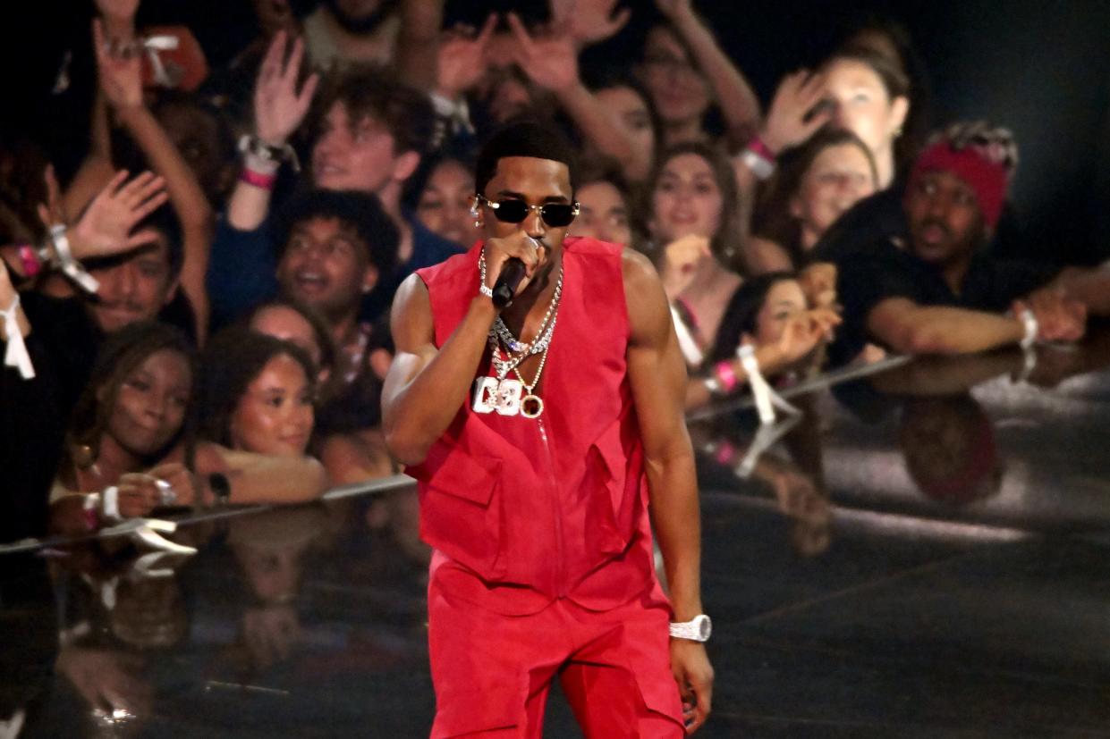 Christian "King" Combs, pictured performing in 2023, has been accused of sexual assault in a new lawsuit as his dad, music mogul Sean "Diddy" Combs, faces similar accusations that he has since denied.