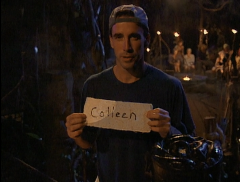 Sean Kenniff holds up a vote reading "Colleen" in Survivor: Borneo