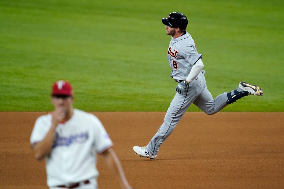 Tigers left fielder Robbie Grossman rounds the bases after hitting a solo home run off of Rangers pitcher Dane Dunning, left front, in the fourth inning in Arlington, Texas, Tuesday, July 6, 2021.