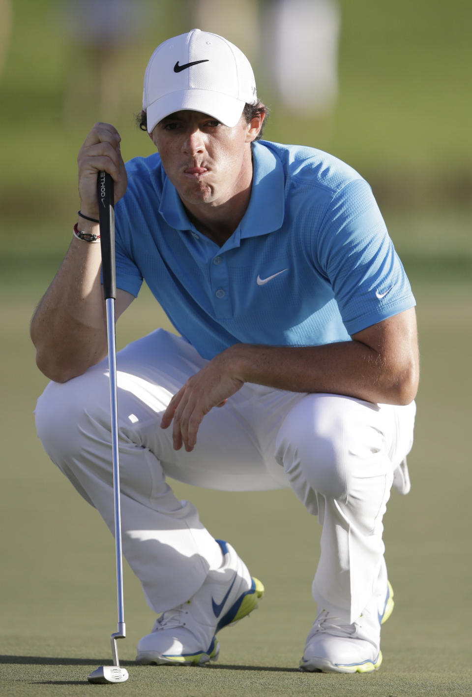 Golfer Rory McIlroy, of Northern Ireland, lines up a putt on the 16th hole during the final round of the Honda Classic golf tournament on Sunday, March 2, 2014, in Palm Beach Gardens, Fla. (AP Photo/Wilfredo Lee)