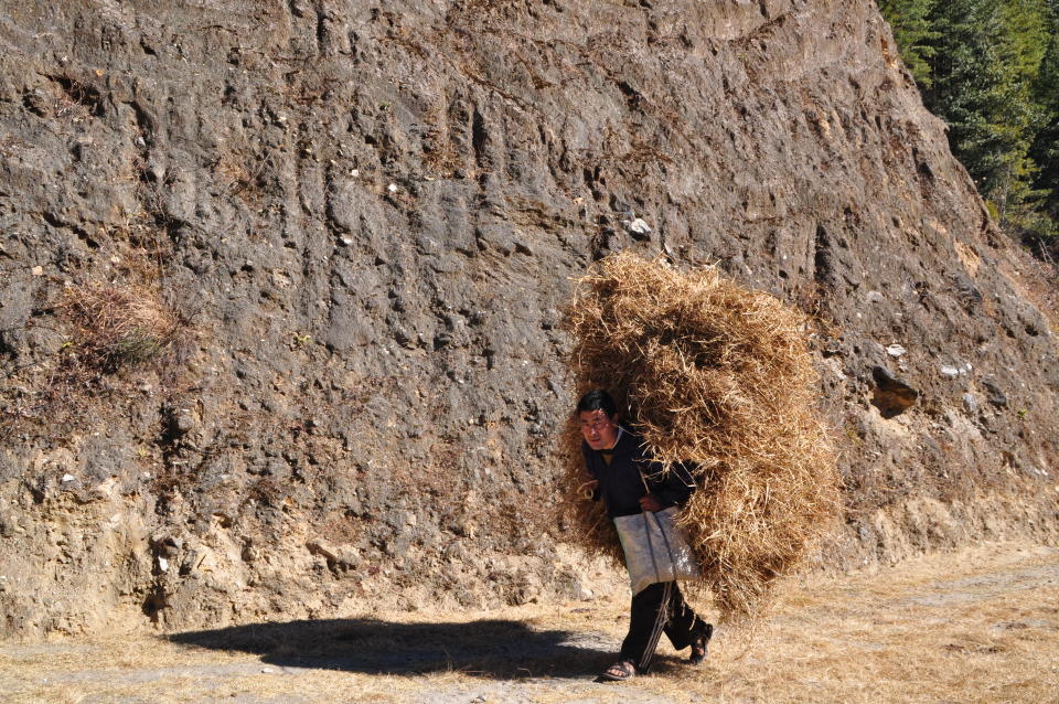 <p>A man hard at work in Bhutan.</p>