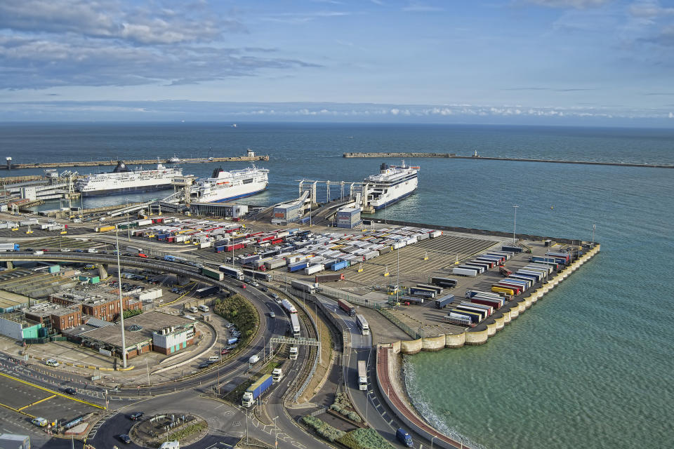 View at Dover port with ferries and lorries in sight.