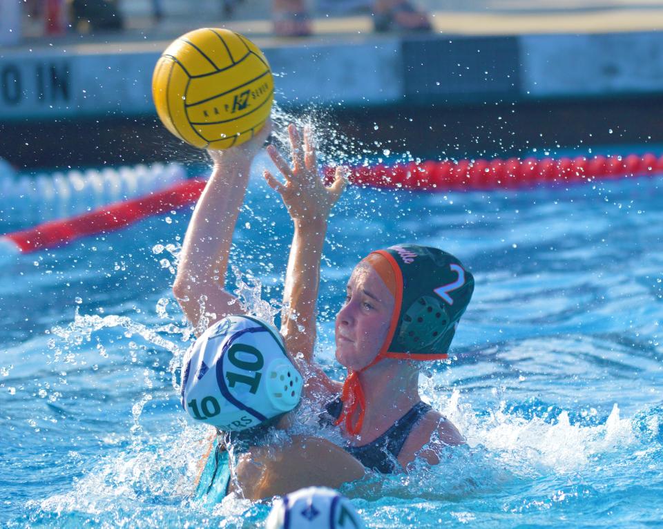 Porterville's Addy Merritt (2) scores one of her four goals on Nov. 13, 2021 in the Central Section Division III girls water polo championship game. Porterville defeated El Diamante 9-5.