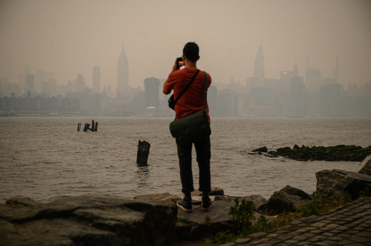 Smoke from the hundreds of wildfires blazing in eastern Canada has drifted south. Hundreds of wildfires were burning in Canada on June 6, 2023, according to the Canadian Interagency Forest Fire Centre, as fires have broken out across the country in recent weeks.  (Ed Jones / AFP - Getty Images)