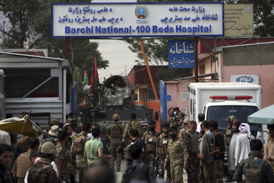 Afghan security officers stand in front of a maternity hospital, in Kabul, Afghanistan, Tuesday, May 12, 2020. Militants stormed a maternity hospital in the western part of Kabul on Tuesday, setting off an hours-long shootout with the police and killing over a dozen people, including two newborn babies, their mothers and an unspecified number of nurses (AP Photo/Rahmat Gul)