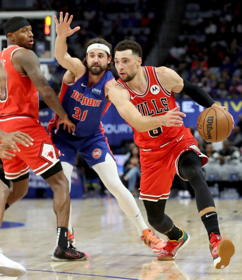 Detroit Pistons forward Joe Harris (31) defends against Chicago Bulls guard Zach LaVine (8) during first-quarter action at Little Caesars Arena in Detroit on Saturday, Oct. 28, 2023.