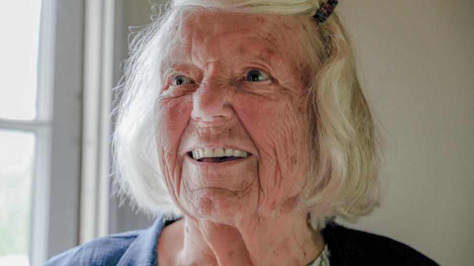 Kingston resident Betty Faella, 93, visits a historic schoolhouse behind the Tavern Hall Club that she attended as a child.