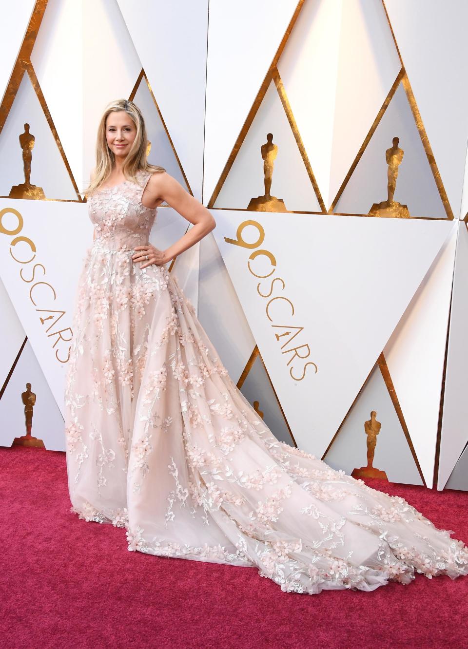 <p>Mira Sorvino wears princess-style dress covered in glass beading designed by Romona Keveža. Simply stunning.</p>