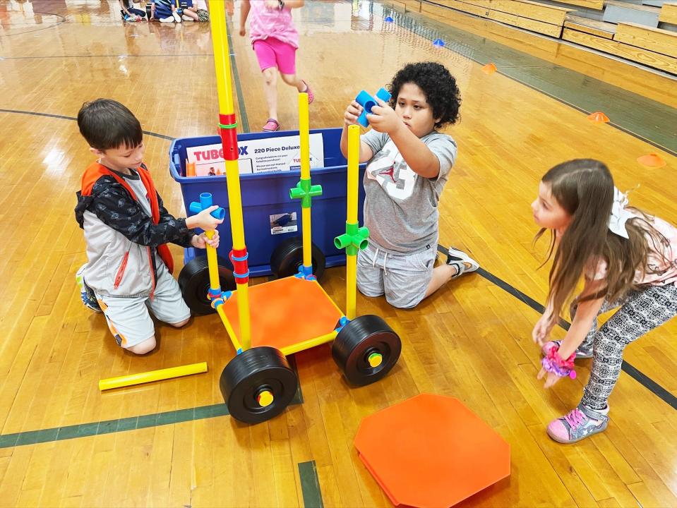 First-grade students at Claxton Elementary School use “TubeLox” building materials purchased with UCOR mini-grants award funds to study the engineering process of designing a car.