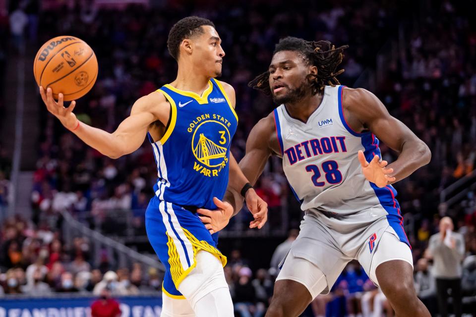 Golden State Warriors guard Jordan Poole (3) looks to pass the ball against Detroit Pistons center Isaiah Stewart (28) during the second quarter Nov. 19, 2021 at Little Caesars Arena.