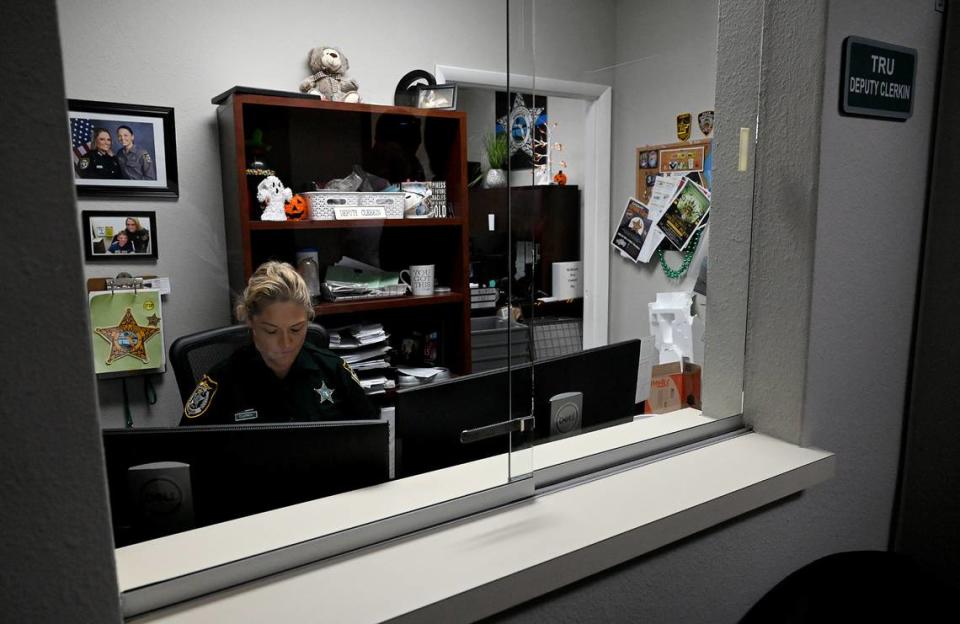 A Manatee County Sheriff’s Office deputy sits in the administration area of the Under One Roof facility, which will provide transitional housing for local families in the coming months.