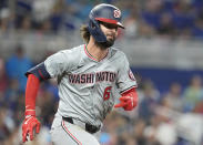 Washington Nationals' Jesse Winker (6) runs to first base after hitting a single during the sixth inning of a baseball game against the Miami Marlins, Saturday, April 27, 2024, in Miami. (AP Photo/Marta Lavandier)