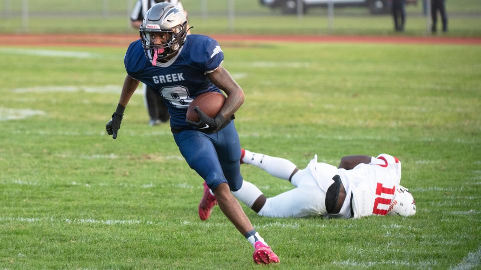 Timber Creek's Zyheem Coleman Frazier runs the ball in for a touchdown during the football game between Timber Creek and Rancocas Valley played at Timber Creek Regional High School in Sicklerville on Friday, September 16, 2022.  Timber Creek defeated Rancocas Valley, 28-15.  