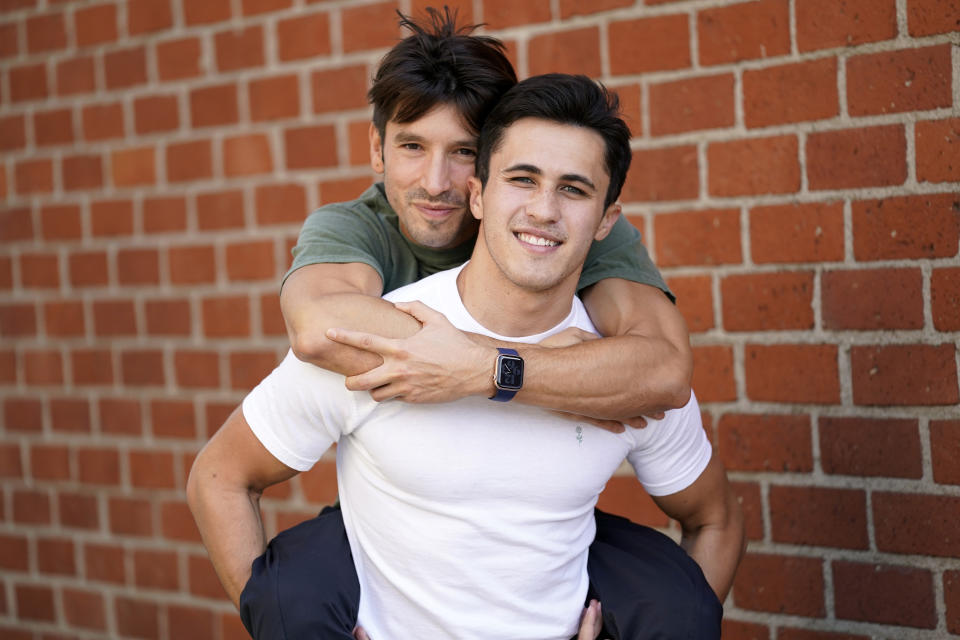 TikTok personalities Ian Paget, left, and Chris Olsen pose for a portrait in West Hollywood, Calif. on Oct. 20, 2020. Paget and Olsen, gay partners in Los Angeles, have amassed more than 4 million followers who love and encourage them as they hunker down at home, churning out goofy dance videos and playing the constant pranks that are stock-in-trade on TikTok. (AP Photo/Chris Pizzello)