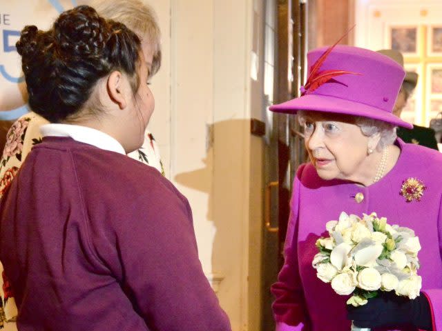 Olivia Yousaf presents the Queen with a posy (Victoria Jones/PA)