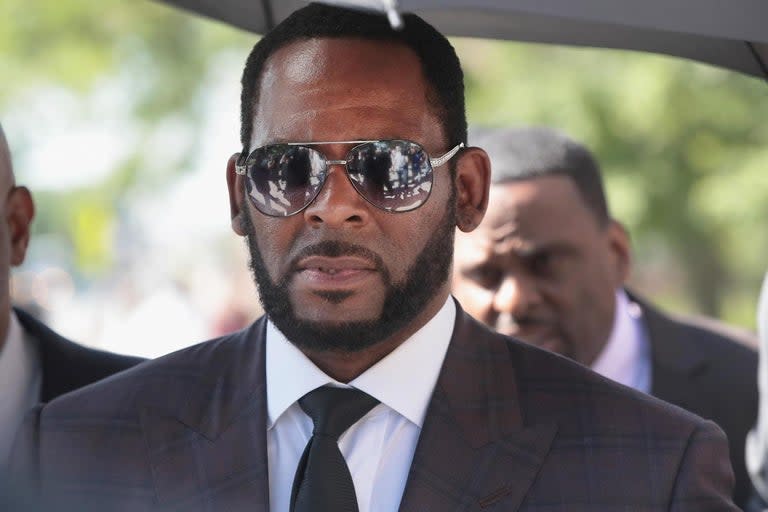 R Kelly has been ordered held at a Chicago jail without bond over federal charges that he allegedly ran a racketeering scheme trafficking women and girls for sex.US District Judge Harry Leinenweber handed down the ruling on Tuesday in Chicago, where Kelly was arrested last week. Kelly, wearing an orange jumpsuit and shackled at the ankles, did not speak except to say "yes sir" when the judge asked if he understood the charges. His attorney, Steve Greenberg, submitted a not guilty plea.Prosecutors asked a judge to keep the singer in custody, calling him an "extreme danger to the community, especially to minor girls", according to the Chicago Sun-Times.In indictments unsealed in Brooklyn, New York, and Chicago on Friday, prosecutors alleged that Kelly, 52, forcibly kept people under his control and then intimidated witnesses and bought their silence.Kelly, already charged with sexual assault in Illinois, was taken into custody by New York City police detectives and federal agents on Thursday in Chicago.He faces counts ranging from enticing a minor to child pornography and obstruction of justice.Kelly's lawyer Steve Greenberg in a statement on Friday said charges stem mostly from "decades-old" conduct and were already part of the Illinois case or previous allegations of which Kelly was acquitted.Additional reporting by agencies