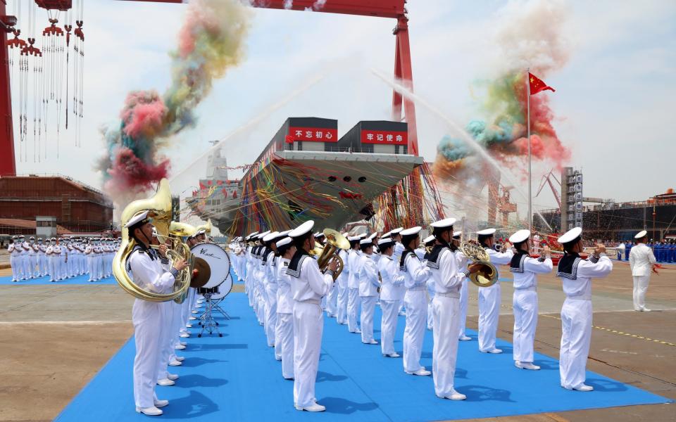 A launching ceremony for China's third aircraft carrier, the Fujian, in Shanghai last June 