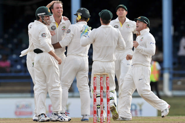 Australian bowler Michael Beer (2nd L) and teammates celebrate lbw call against West Indies batsmen Adrian Barath during the second day of the second-of-three Test matches between Australia and West Indies April 16, 2012 at Queen's Park Oval in Port of Spain, Trinidad. AFP PHOTO/Stan HONDA