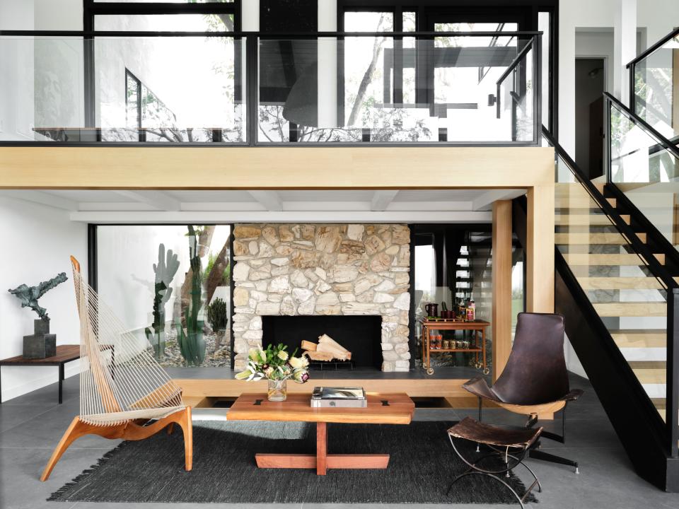 “I wanted to bring together midcentury pieces and modern pieces,” says Naouri. The living room includes a 1968 lounge chair by Jorgen Hovelskov for Christensen and Larsen and a coffee table by George Nakashima, from the 1990s.