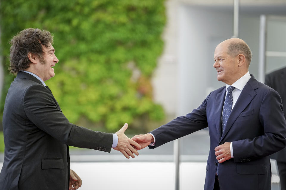 German Chancellor Olaf Scholz, right, and Argentina's President Javier Milei shake hands during their meeting at the chancellery in Berlin, Germany, Sunday, June 23, 2024. (Kay Nietfeld/dpa via AP)