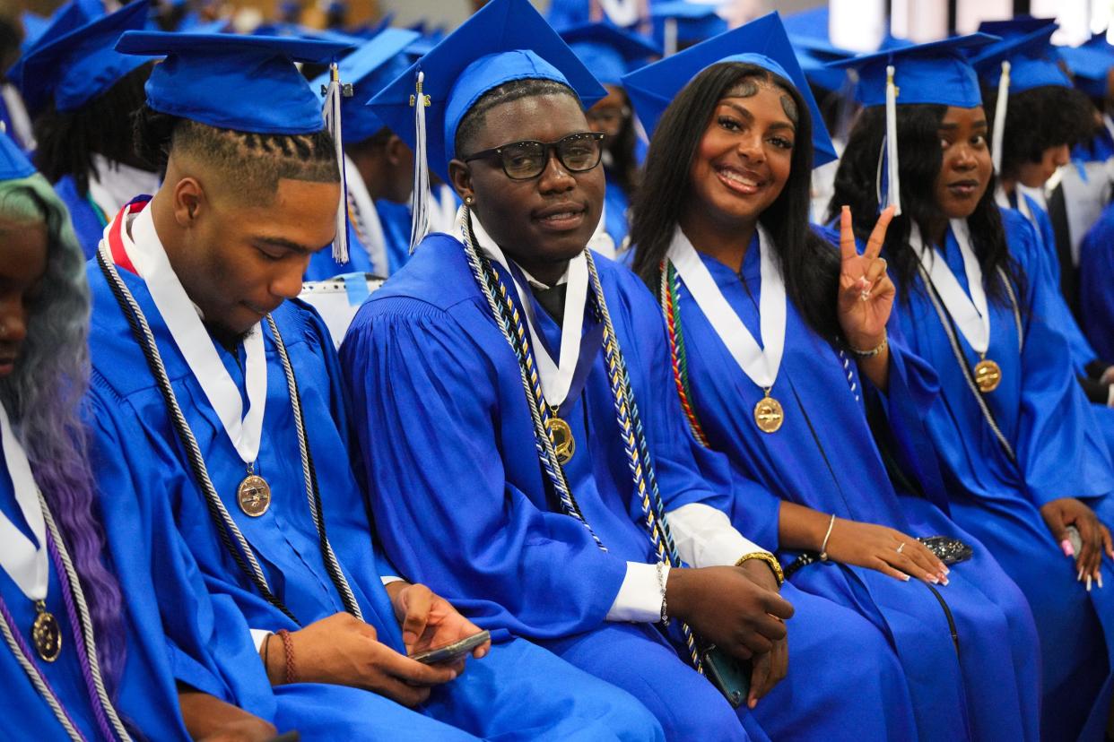 Inlet Grove High SchoolÕs (center) Joshua Anderson, 18, and Leyla Balthazar, 17 (right) are pictured before their graduation ceremony at the South Florida Fairgrounds on Tuesday May 14, 2024 in West Palm Beach.