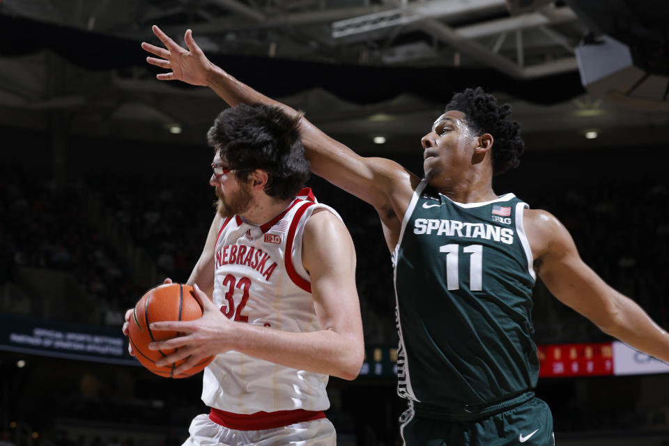 Nebraska's Wilhelm Breidenbach, left, looks to shoot as Michigan State's A.J. Hoggard defends during the first half of an NCAA college basketball game Tuesday, Jan. 3, 2023, in East Lansing, Mich. (AP Photo/Al Goldis)