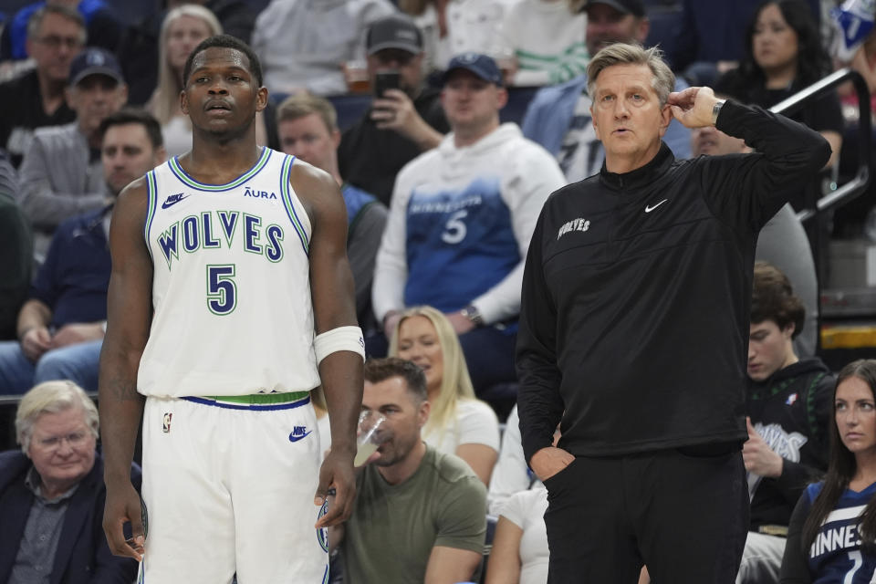 Minnesota Timberwolves guard Anthony Edwards (5) and head coach Chris Finch stand on the court during the second half of an NBA basketball game against the Los Angeles Clippers, Sunday, March 3, 2024, in Minneapolis. (AP Photo/Abbie Parr)