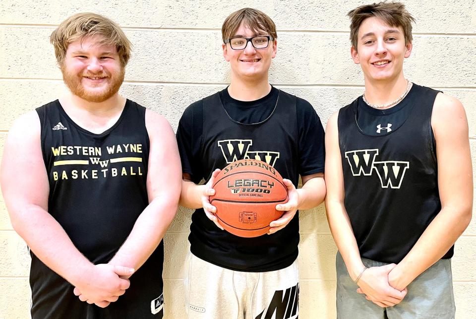 Kyle Guarino (at left) is playing a key role for this year's edition of the Western Wayne boys varsity basketball team. He's pictured here with teammates Evan Dean and Dustin Ferraro.