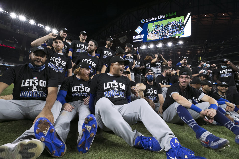 ARLINGTON, TX - OCTOBER 08:  The Los Angeles Dodgers celebrate with a team photo on the field after a 12-3 win in Game 3 of the NLDS between the Los Angeles Dodgers and the San Diego Padres at Globe Life Field on Thursday, October 8, 2020 in Arlington, Texas. (Photo by Kelly Gavin/MLB Photos via Getty Images)