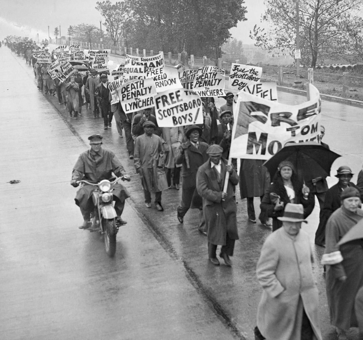 Demonstrators march on Jan. 1, 1934, in Washington against the unjust trials of nine Black men falsely accused of raping two white women. <a href="https://www.gettyimages.com/detail/news-photo/hundreds-of-demonstrators-march-in-washington-d-c-against-news-photo/514685542?adppopup=true" rel="nofollow noopener" target="_blank" data-ylk="slk:Bettmann/Getty Images;elm:context_link;itc:0;sec:content-canvas" class="link ">Bettmann/Getty Images</a>