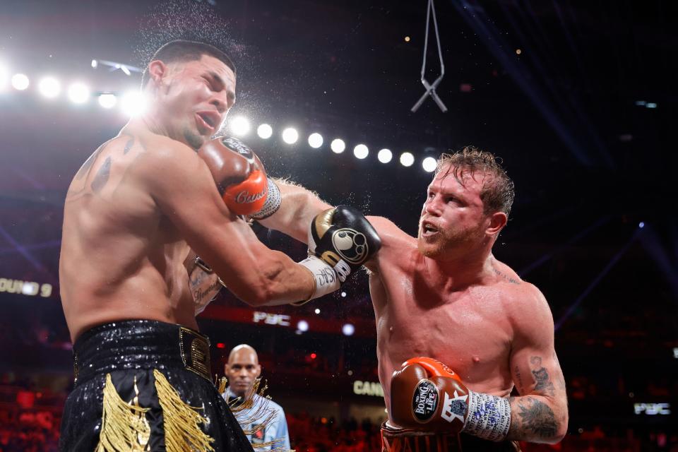 LAS VEGAS, NEVADA - SEPTEMBER 14: WBC/WBA/WBO super middleweight champion Canelo Alvarez (R) punches Edgar Berlanga during the ninth round of a title fight at T-Mobile Arena on September 14, 2024 in Las Vegas, Nevada. (Photo by Steve Marcus/Getty Images)