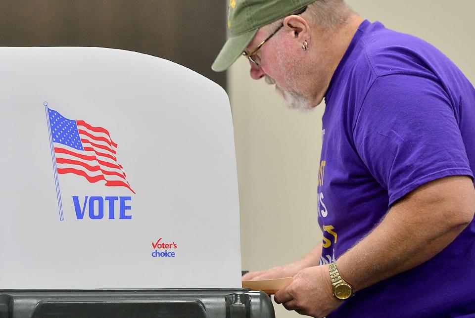 Stephen Jordan, of Halfway, fills out his ballot at the county election board headquarters on Virginia Avenue in Halfway Thursday on the first day of early voting for the Maryland gubernatorial primary election. 