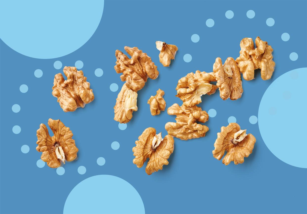 The Benefits of Walnuts , Peeled walnut isolated on blue background