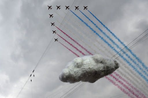 The Red Arrows formation jets fly over the stadium prior the opening ceremony of the London 2012 Olympic Games