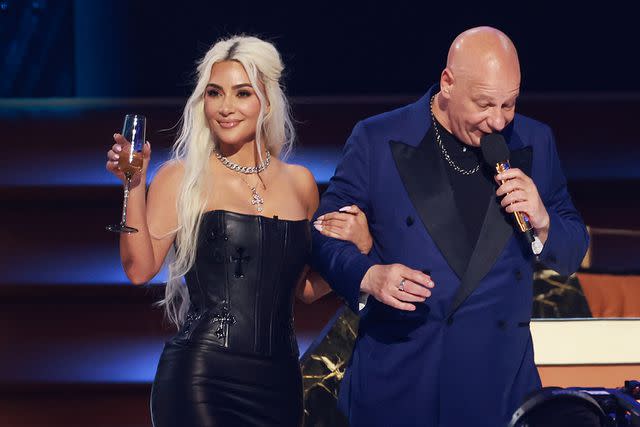 <p>Matt Winkelmeyer/Getty</p> L-R) Kim Kardashian and Jeff Ross speak onstage during G.R.O.A.T The Greatest Roast Of All Time: Tom Brady