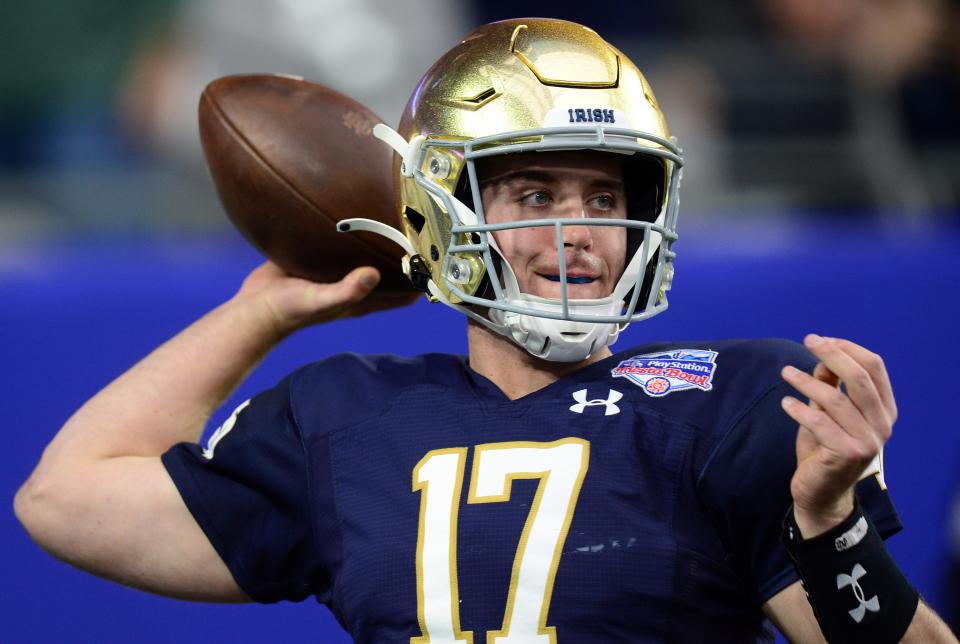 Jan 1, 2022; Glendale, Arizona, USA; Notre Dame Fighting Irish quarterback Jack Coan (17) warms up prior to facing the Oklahoma State Cowboys in the 2022 Fiesta Bowl at State Farm Stadium. Mandatory Credit: Joe Camporeale-USA TODAY Sports