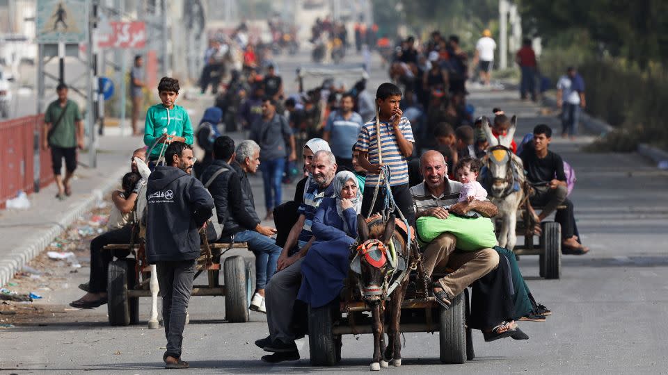 Palestinians ride on animal-drawn carts, as people flee north Gaza towards the south, amid the ongoing conflict between Israel and Palestinian Islamist group Hamas, in the central Gaza Strip, November 9, 2023. REUTERS/Mohammed Salem - Mohammed Salem/Reuters