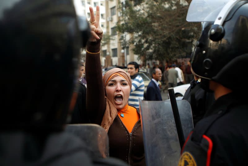 FILE PHOTO: An anti-government protester gestures during clashes with police in Cairo