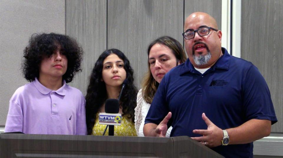 Luis Velez., right, speaks during the press conference Thursday afternoon at Piedmont Columbus Regional Hospital in Columbus, Georgia. With him are, from left, his son Alex, daughter Ella, and wife Lorna. 05/23/2024