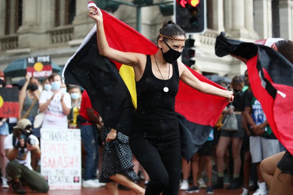 Protesters dance during an Invasion Day rally in Brisbane in 2022.