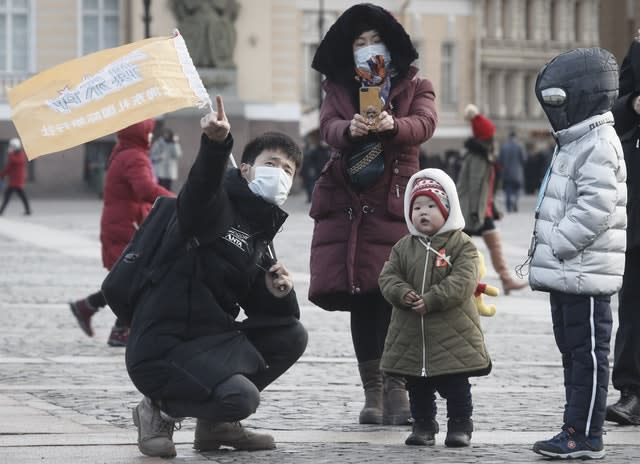 Chinese tourists wearing protective face masks in St Petersburg, Russia 