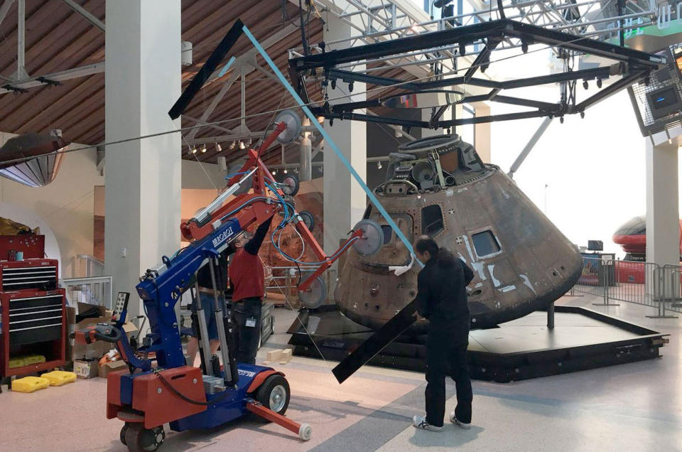 Installation of glass panels for the Apollo-Soyuz Test Project command module's new display case at the California Science Center. <cite>California Science Center/Perry Roth-Johnson</cite>
